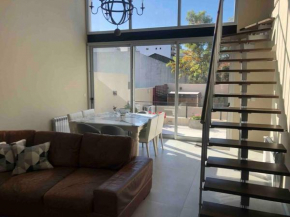 Modern Two-story House with Terrace in Nuñez River